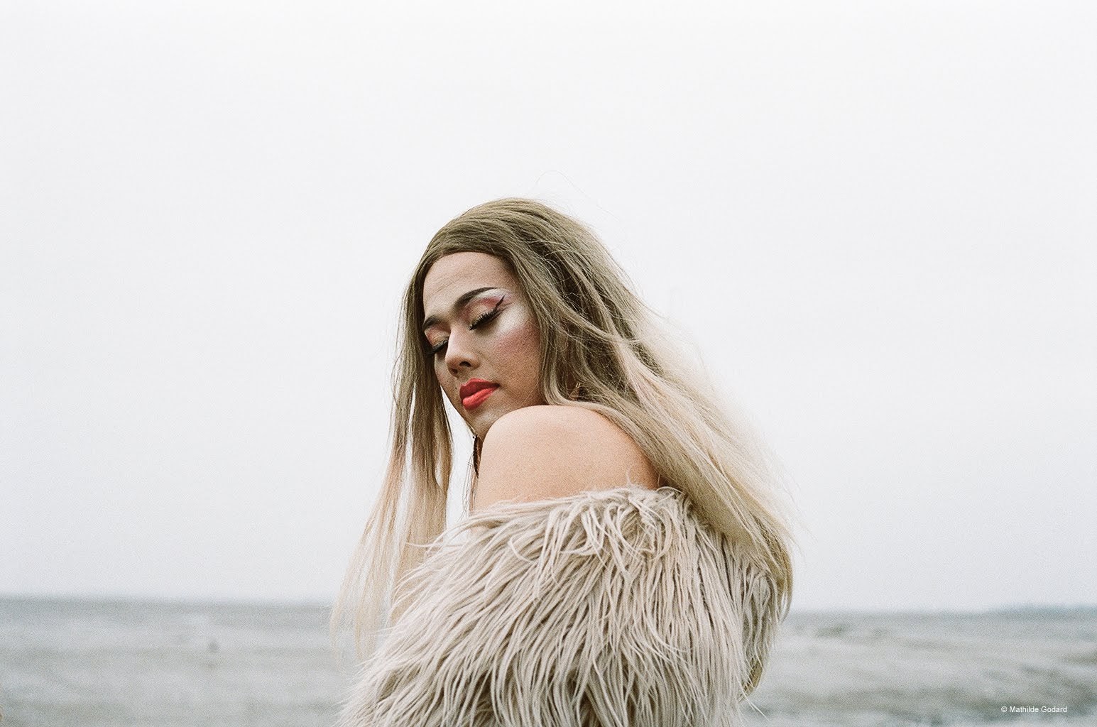 beautiful photo of blonde trans woman on the beach