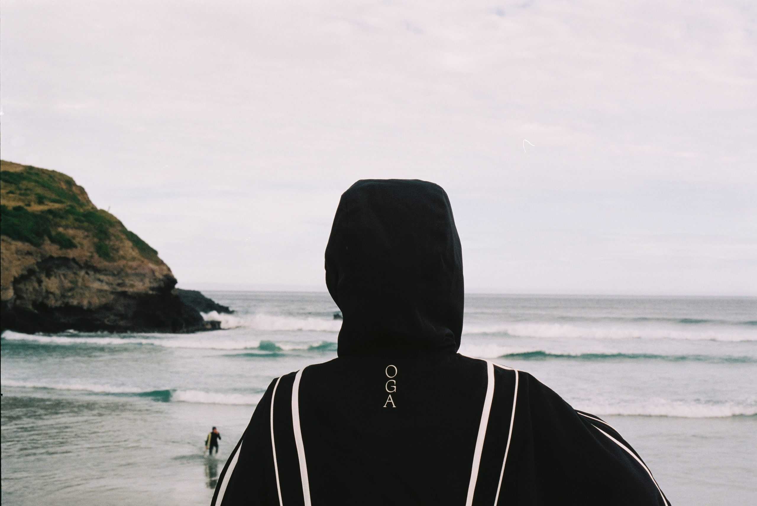 looking at the ocean with raincoat