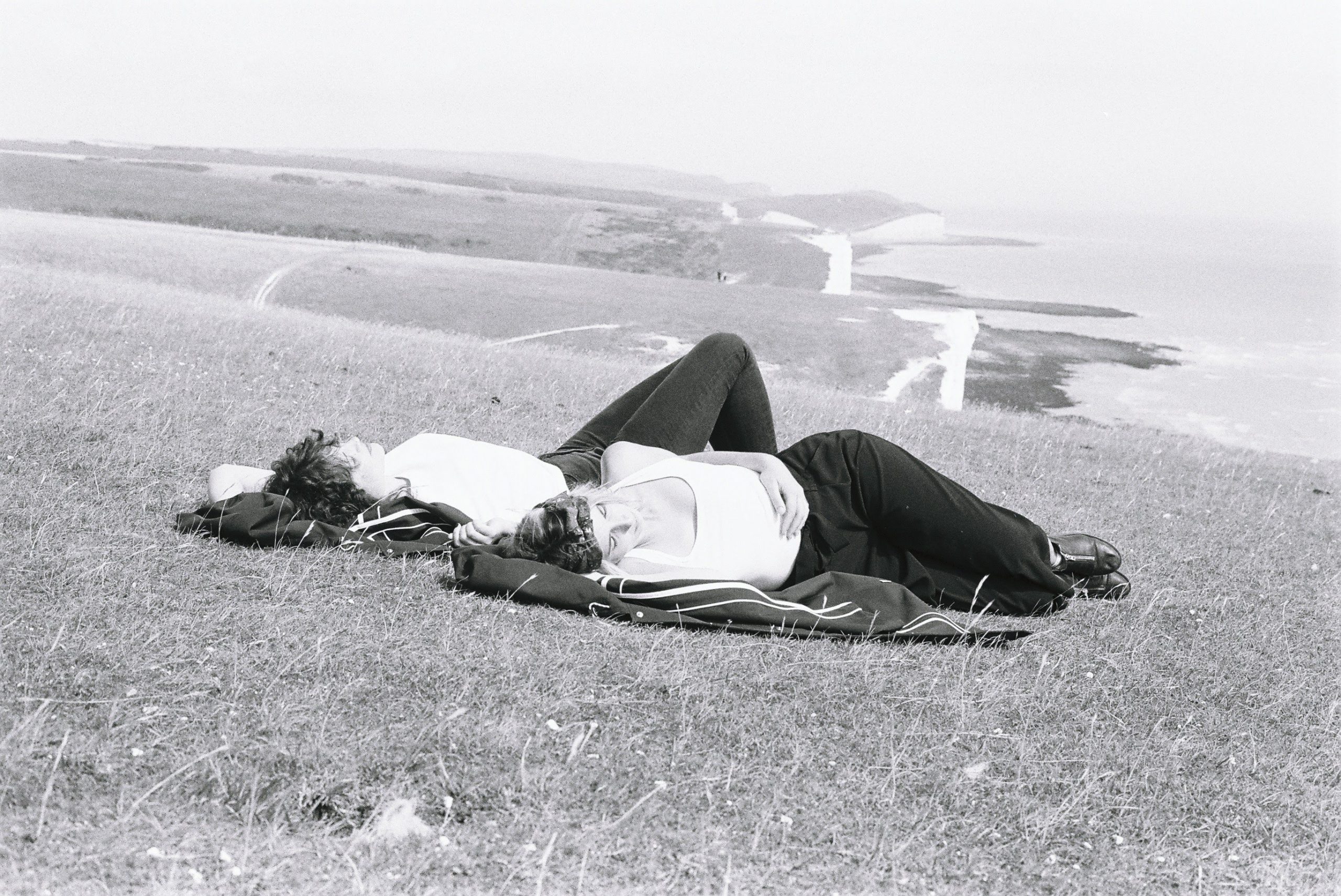 two woman having a nap on the english coast