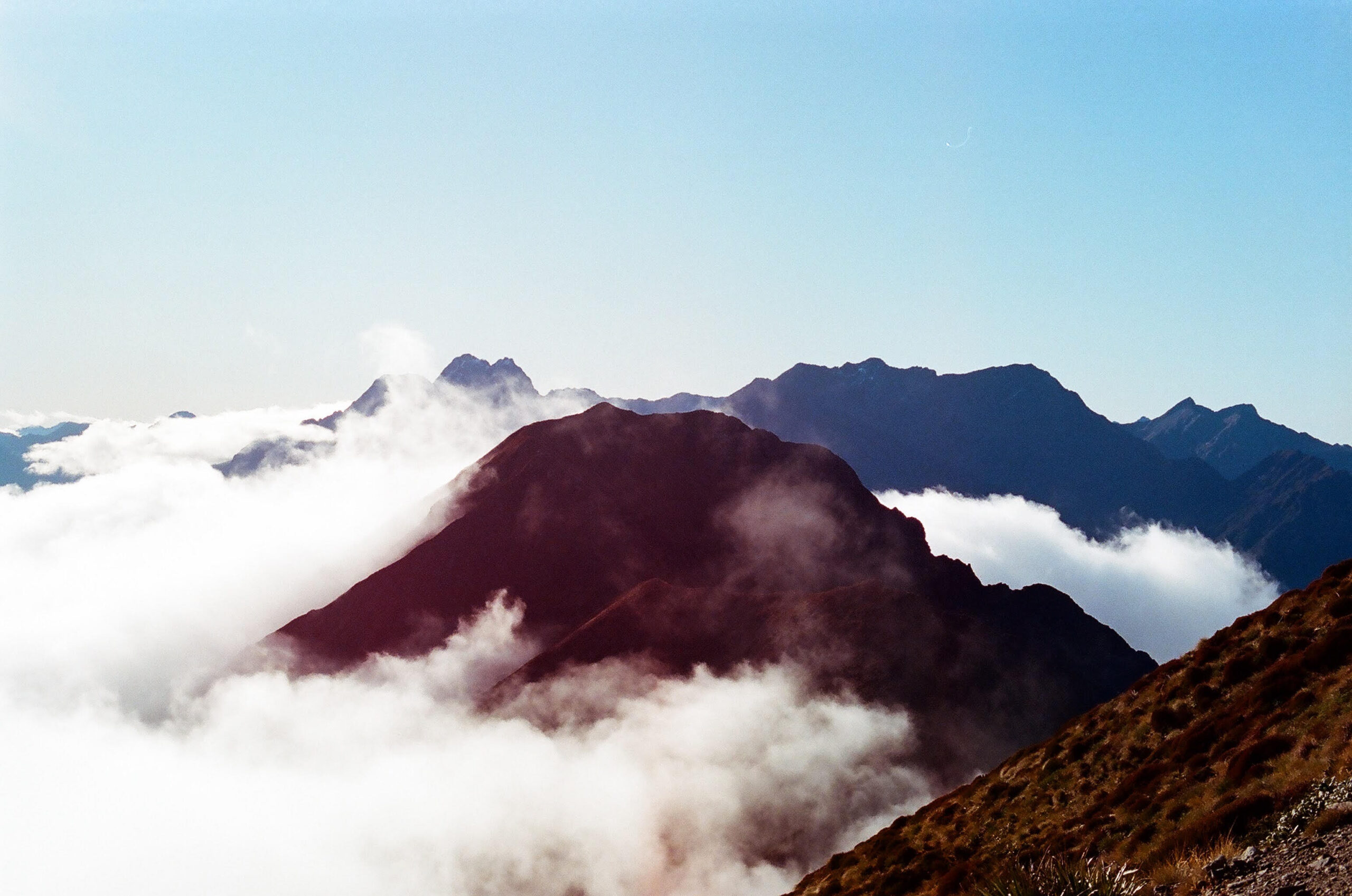 Mountain top above clouds in New-Zealand